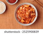 Kimchi, Kimchee in the Bowl, Red Spicy Kim Chi, Hot Fermented Napa Cabbage, Traditional Jimchi, Korean cuisine, top view horizontal banner with a copy space