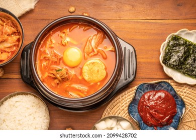 Kimchi stew or Kimchi soup, Korea’s national dish spicy soup with vegetable, meat, eggs, tofu served in a hot pot. Kimchi Jjigae korean trditional food. - Shutterstock ID 2099428702