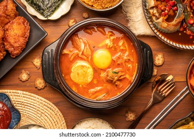 Kimchi stew or Kimchi soup, Korea’s national dish spicy soup with vegetable, meat, eggs, tofu served in a hot pot. Kimchi Jjigae korean trditional food. - Shutterstock ID 2100477730