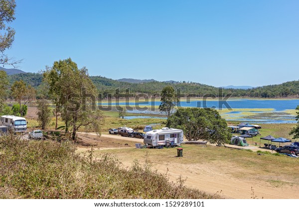 Kinchant\
Dam, Queensland, Australia - October 2019: Holidaymakers enjoying\
the last weeks of this camping ground before the local council\
closes it down for not conforming to\
regulations