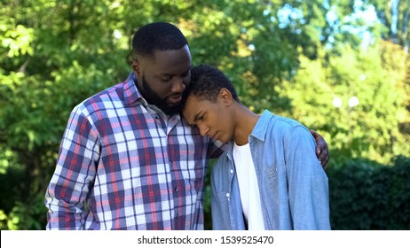 Kind Father Hugging Teenage Son Admitting Guilt, Child Upbringing, Parenting