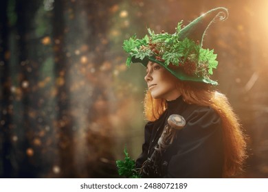 A kind forest witch-sorceress with red hair, dressed in a black dress and a green hat, sits in a forest clearing, surrounded by sunlight and magical lights. Copy space. Fantasy. Halloween.