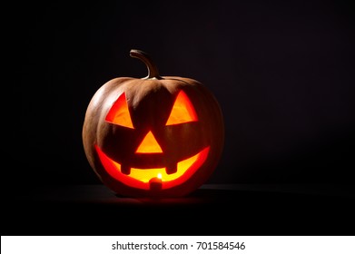 Kind Halloween Pumpkin On A Black Background