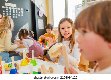 Kindergarten Children Learning Music Using Various Colorful  Instruments. Learning Music For Kids Using Colors. Montessori Music Activities For Preschoolers.