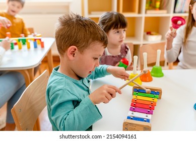 Kindergarten Children Learning Music Using Various Colorful  Instruments. Learning Music for Kids using Colors. Montessori Music Activities for Preschoolers. - Shutterstock ID 2154094161