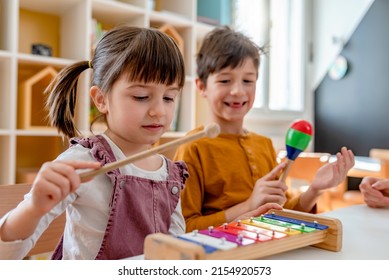 Kindergarten Children Learning Music Using Various Colorful  Instruments. Learning Music For Kids Using Colors. Montessori Music Activities For Preschoolers.