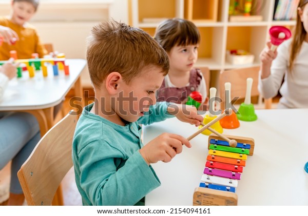 Kindergarten Children Learning Music\
Using Various Colorful  Instruments. Learning Music for Kids using\
Colors. Montessori Music Activities for\
Preschoolers.