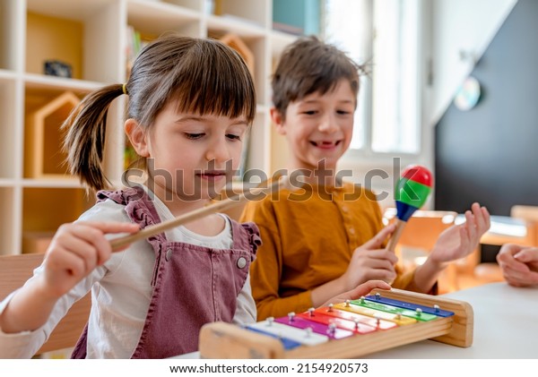 Kindergarten Children Learning Music\
Using Various Colorful  Instruments. Learning Music for Kids using\
Colors. Montessori Music Activities for\
Preschoolers.
