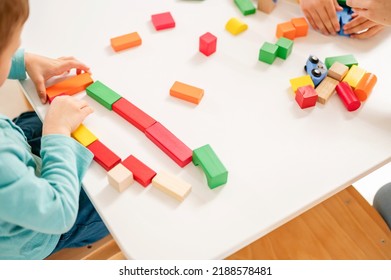 Kindergarten Children Play With Colorful Building Blocks. Healthy Learning Environment. Learning Through Play.
