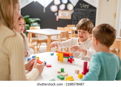 Kindergarten Children Playing With Colorful Building Blocks. Healthy Learning Environment. Learning Through Play.