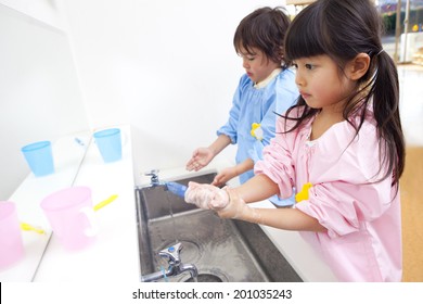 Kindergarten children to wash their hands - Powered by Shutterstock