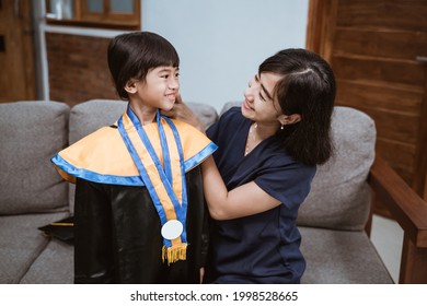 Kindergarten Graduation. Asian Family And Parent On Her Kid Kinder Graduate Day.