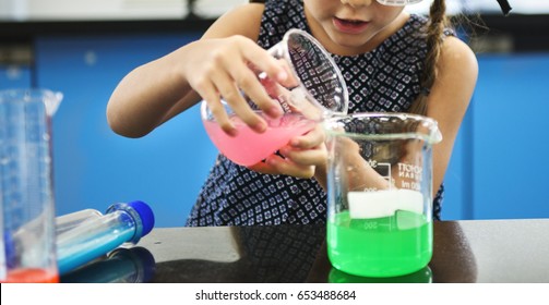 Kindergarten Student Mixing Solution in Science Experiment Laboratory Class