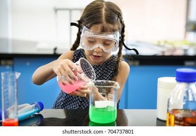 Kindergarten Student Mixing Solution in Science Experiment Laboratory Class
