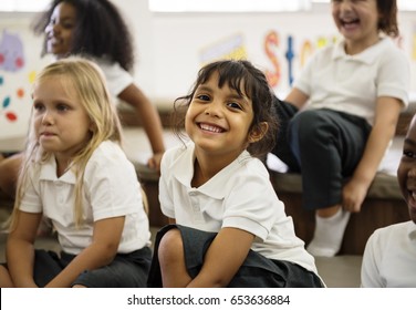 Kindergarten students sitting on the floor