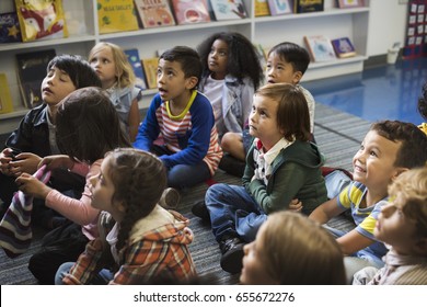 Kindergarten Students Sitting On The Floor