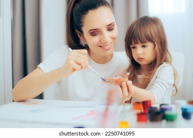 
Kindergarten Teacher Painting Her Student Hands  Happy kid learning about finger painting   creativity
