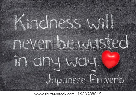 Kindness will never be wasted in any way Japanese proverb written on chalkboard with vintage precise stopwatch