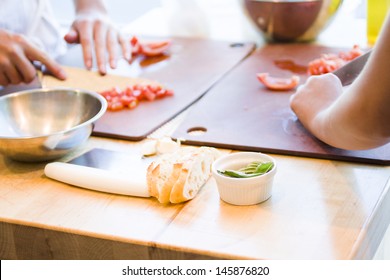 Kinds In Cooking Class Making Bruschetta.