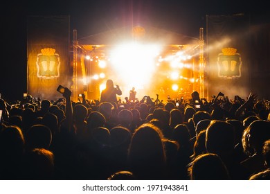 KINESHMA, RUSSIA - AUGUST 30, 2018: Live Concert Of The Popular Russian Rap Singer Basta On Stage From The Label Gazgolder. Silhouettes Of The Audience On A Musical Night Performance