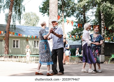 Kineshma, Russia - July, 2021: Active Happy Seniors, People Dancing In Central Park To The Sounds Of A Live Orchestra, Young At Heart, Active Old Age, Lifestyle Concept. 