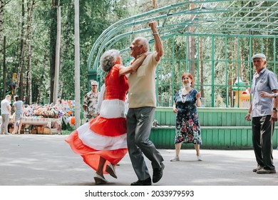 Kineshma, Russia - July, 2021: Active Happy Seniors, People Dancing In Central Park To The Sounds Of A Live Orchestra, Young At Heart, Active Old Age, Lifestyle Concept. 