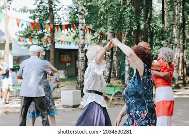 Kineshma, Russia - July, 2021: Active Happy Seniors, People Dancing In Central Park To The Sounds Of A Live Orchestra, Young At Heart, Active Old Age, Lifestyle Concept. 