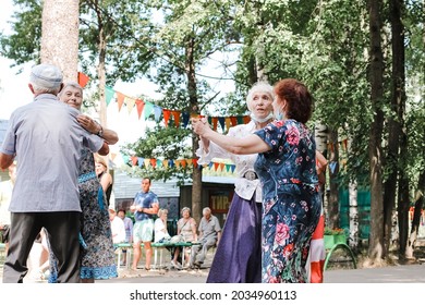 Kineshma, Russia - July, 2021: Active Happy Seniors, People Dancing In Central Park To The Sounds Of A Live Orchestra, Young At Heart, Active Old Age, Lifestyle Concept. 