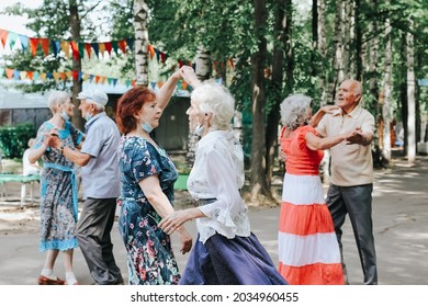 Kineshma, Russia - July, 2021: Active Happy Seniors, People Dancing In Central Park To The Sounds Of A Live Orchestra, Young At Heart, Active Old Age, Lifestyle Concept. 