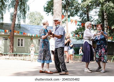 Kineshma, Russia - July, 2021: Active Happy Seniors, People Dancing In Central Park To The Sounds Of A Live Orchestra, Young At Heart, Active Old Age, Lifestyle Concept. 