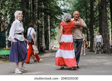 Kineshma, Russia - July, 2021: Active Happy Seniors, People Dancing In Central Park To The Sounds Of A Live Orchestra, Young At Heart, Active Old Age, Lifestyle Concept. 