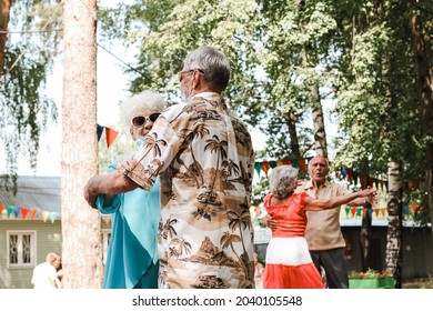 Kineshma, Russia - July, 2021: Active Happy Seniors, People Dancing In Central Park To The Sounds Of A Live Orchestra, Young At Heart, Active Old Age, Lifestyle Concept. 