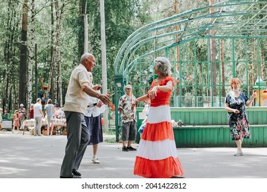 Kineshma, Russia - July, 2021: Active Happy Seniors, People Dancing In Central Park To The Sounds Of A Live Orchestra, Young At Heart, Active Old Age, Lifestyle Concept. 