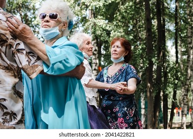 Kineshma, Russia - July, 2021: Active Happy Seniors, People Dancing In Central Park To The Sounds Of A Live Orchestra, Young At Heart, Active Old Age, Lifestyle Concept. 