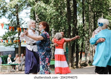 Kineshma, Russia - July, 2021: Active Happy Seniors, People Dancing In Central Park To The Sounds Of A Live Orchestra, Young At Heart, Active Old Age, Lifestyle Concept. 