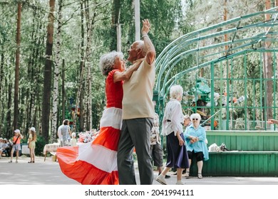 Kineshma, Russia - July, 2021: Active Happy Seniors, People Dancing In Central Park To The Sounds Of A Live Orchestra, Young At Heart, Active Old Age, Lifestyle Concept. 