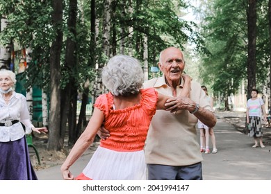 Kineshma, Russia - July, 2021: Active Happy Seniors, People Dancing In Central Park To The Sounds Of A Live Orchestra, Young At Heart, Active Old Age, Lifestyle Concept. 