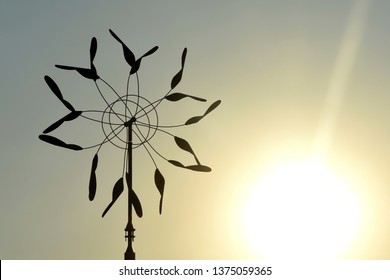 Kinetic Art Sculpture In Motion At Sunset