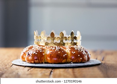 King Bread, called in German language Dreikönigskuchen, baked in Switzerland on January 6th. Small plastic miniature of the king is hidden inside of the bread. The person who finds it, is the king.