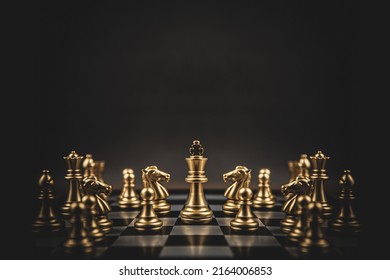 King chess stand on chessboard concepts of teamwork volunteer challenge business team or wining and leadership strategy or strategic planning and risk management or team player.