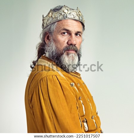 King, crown with senior man and portrait, history with renaissance and royalty isolated on white background. Vintage, medieval and worship, face and male monarch mockup with gold and cosplay