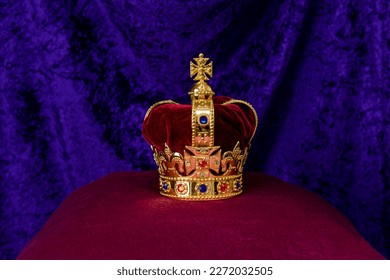 King Edwards Crown to be used by King Charles III for his Coronation sits on a purple pillow with a purple background.  - Shutterstock ID 2272032505