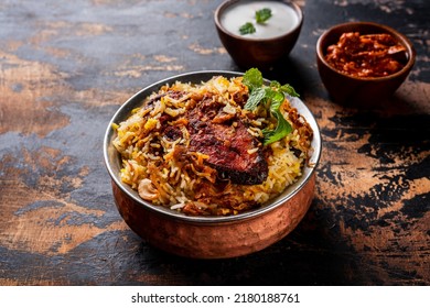 King Fish Biryani With Raita Served In A Golden Dish Isolated On Dark Background Side View Food