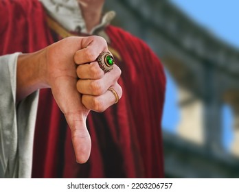 King Giving A Thumbs Down In A Colosseum Arena Blurred Background.