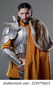 The King. Handsome Medieval Knight In Armor And Yellow Cloak.