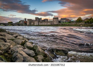 The King John Castle Over The Shannon River In Limerick At Sunset, Ireland