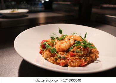 King Prawn Arrabbiata Risotto With Parmesan Crisp And Herb Oil