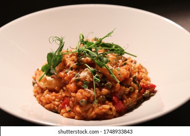 King Prawn Arrabbiata Risotto With Parmesan Crisp And Herb Oil