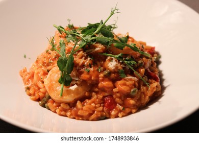 King Prawn Arrabbiata Risotto With Parmesan Crisp And Herb Oil