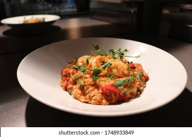 King Prawn Arrabbiata Risotto With Parmesan Crisp And Herb Oil